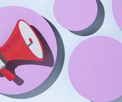a color illustration of a red megaphone in a light purple circle with other light purple circles around it